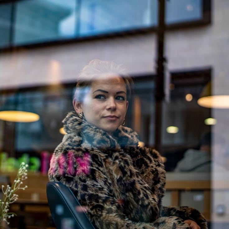 Maya Chen, Client Relations Director, discussing corporate gifting strategy with business clients